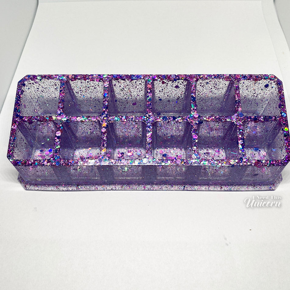 A single purple glittery resin lipstick organizers with 12 wells