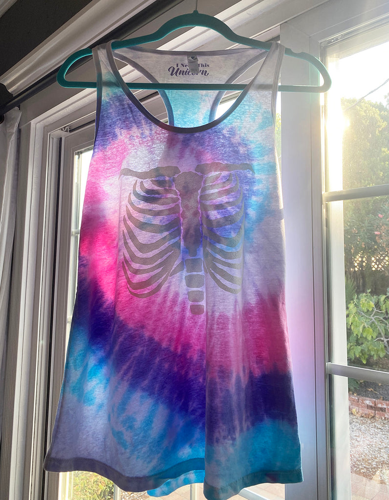 Pastel Unicorn blue pink purple tie dye racker back tank top with a puffy glow-in-the-dark ribcage graphic